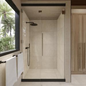 a shower with a glass door in a bathroom at New Luxury Ribamar Villas in Uluwatu