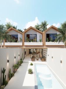 an external view of a house with a swimming pool at New Luxury Ribamar Villas in Uluwatu