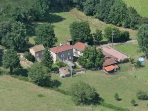 an aerial view of a house on a hill at Gîte au calme avec terrasse et randonnées à Montagny - FR-1-496-201 in Montagny