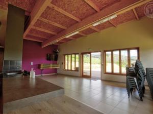 a large room with chairs and a ceiling with windows at Chalet chaleureux avec terrasse privée et animaux acceptés - FR-1-496-242 in Saint-Rirand +14 photos