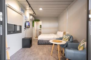 Ένα ή περισσότερα κρεβάτια σε δωμάτιο στο 小琉球好想賴床民宿 +9 φωτογραφίες