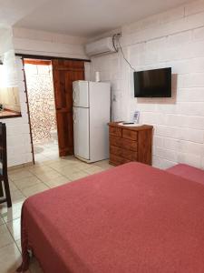 Ένα ή περισσότερα κρεβάτια σε δωμάτιο στο Cabañas El Nogal