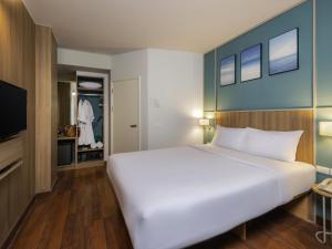 Postel nebo postele na pokoji v ubytování Hotel Ibis Samui Bophut