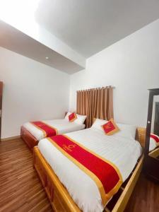 Postel nebo postele na pokoji v ubytování CHERRY HOTEL