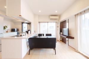 a kitchen with a sink and a counter top at 青葉邸 AOZORA 1002 Near Dotonbori 3LDK 2 Bath 2 WC Premium Tower Residence in Osaka
