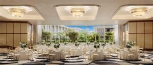 a banquet hall with white tables and chairs at Conrad Athens The Ilisian in Athens
