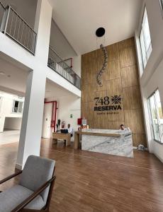 a large room with a lobby with a cross on the wall at Apartment overlooking the water park in Lima