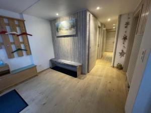 a hallway with a bench in a room at Ferienwohnung Hälmli in Heiden