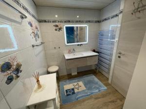 Koupelna v ubytování Ferienwohnung Hälmli + 10 fotografií