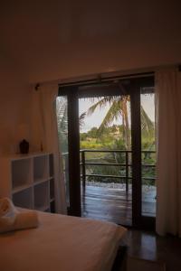 En eller flere senge i et værelse på Lusty Glaze Villa Siargao