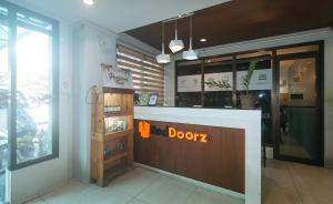 a restaurant with a door with a sign on it at RedDoorz @ Junquera Extension Cebu in Cebu City