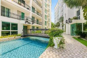 Πισίνα στο ή κοντά στο 芭提雅市中心Olympus 水系公寓酒店 健身房 步行街 海滩附近 一居室