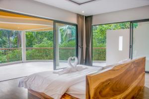 Postel nebo postele na pokoji v ubytování Villa Ocean Breeze