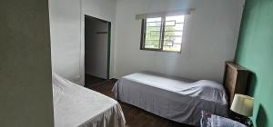 Ένα ή περισσότερα κρεβάτια σε δωμάτιο στο Habitación privada en Boquete