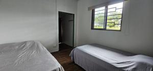 Ένα ή περισσότερα κρεβάτια σε δωμάτιο στο Habitación privada en Boquete