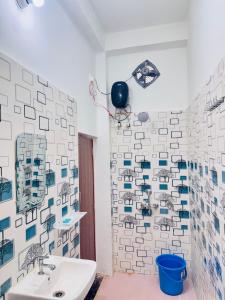 a bathroom with a sink and a toilet at Rita Shree Homestay At Ayodhya Highway in Sultānpur