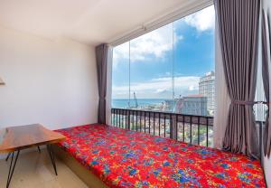 En eller flere senge i et værelse på Simpsons Homestay - Oasky