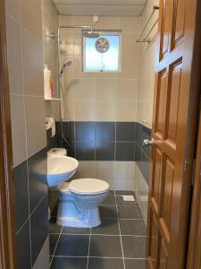 a bathroom with a toilet and a sink at Jo’s Place Cameron Highlands EA922 in Brinchang +22 photos