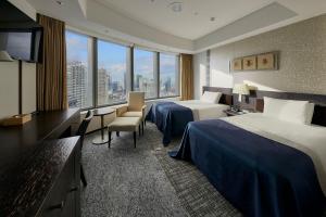 Postel nebo postele na pokoji v ubytování Park Hotel Tokyo + 169 fotografií