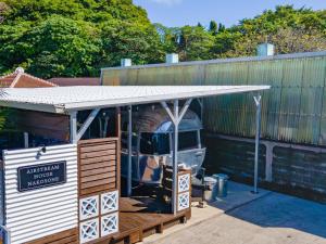 a building with a roof on top of a truck at Air Stream House Nakasone in Nakijin