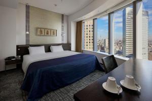 Postel nebo postele na pokoji v ubytování Park Hotel Tokyo