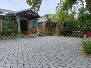 a house with a brick driveway in front of it at DaaiPlek Holiday home in Richards Bay