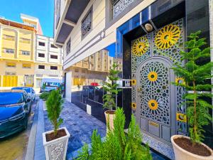 a door to a building with plants in front of it at ELITE Golden Stay - Luxury Apartments in Tangier