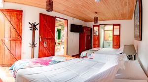 Postel nebo postele na pokoji v ubytování Hotel Kantarrana Urbana Jardin