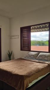 Ένα ή περισσότερα κρεβάτια σε δωμάτιο στο Casa Ori +2 φωτογραφίες