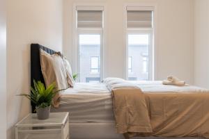 Ένα ή περισσότερα κρεβάτια σε δωμάτιο στο Modern Stylish Retreat