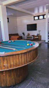 a pool table in a large room with a pool table at Família Macapá in Macapá