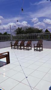 a row of benches sitting on top of a roof at Família Macapá in Macapá
