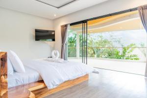 Postel nebo postele na pokoji v ubytování Villa Seaview Eclipse