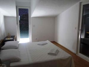 Ένα ή περισσότερα κρεβάτια σε δωμάτιο στο Apartment in Primosten - Sibenik Riviera 35562