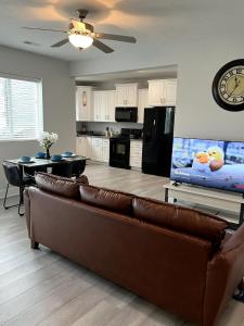 a living room with a couch and a flat screen tv at Blue Diamond Dream in Bennington