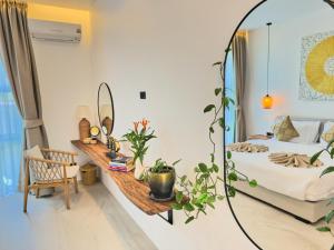 a bedroom with a bed and a mirror at Sunset 3 Bedroom Sea View Villa with Infinity Pool in Chalok Ban Kao in Hinkong +41 photos