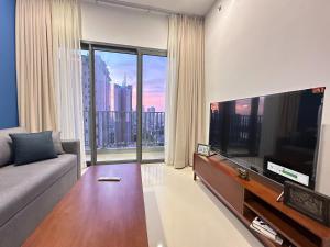 a living room with a large flat screen tv at Colombo Stay - Skyview Retreat in Colombo