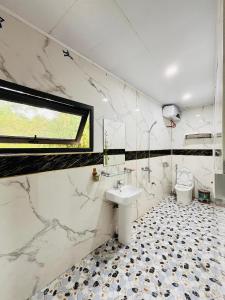 a bathroom with a sink and a toilet at Ha Giang Eco Bungalow in Ha Giang