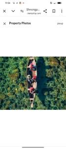 a boat in the water with people on it at Front view campsite in Shillong