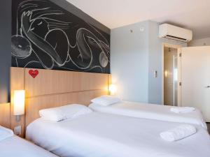 Postel nebo postele na pokoji v ubytování Ibis Foz do Iguaçu