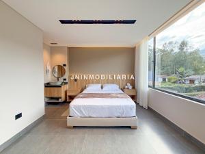 Postel nebo postele na pokoji v ubytování Apartamento de lujo a 3 minutos del Aeropuerto JMC 202
