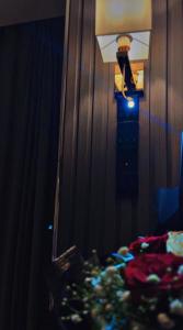 a bedroom with a mirror and a bed and a lamp at شاليهات سمو بارك in Taif