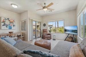 a living room with a couch and a table at Panorama View - Mountain Views - Community Pool in Fountain Hills