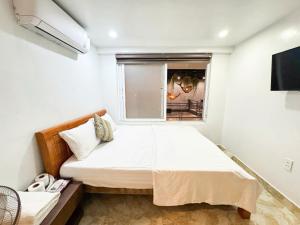 Postel nebo postele na pokoji v ubytování Cat Ba Hong Kong Cozy Stay + 47 fotografií