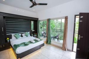 Postel nebo postele na pokoji v ubytování Munnar Premium Villa