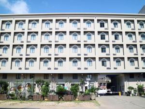 a large white building with a lot of windows at Jinjiang Inn Wenling Daxi in Wenling
