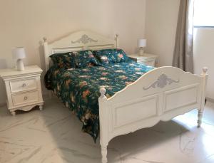 Postel nebo postele na pokoji v ubytování Malanda Falls Retreat