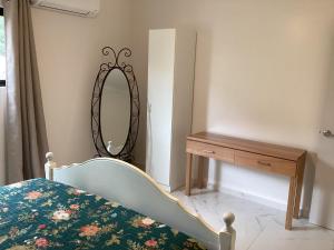 Postel nebo postele na pokoji v ubytování Malanda Falls Retreat