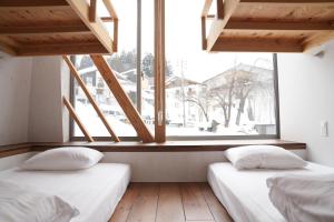 Ένα ή περισσότερα κρεβάτια σε δωμάτιο στο 野沢温泉ロッヂ