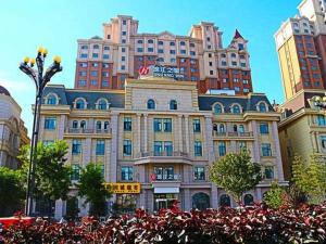 a large building with a lot of tall buildings at Jinjiang Inn Select Xining West Wusi Road New Hualian Square in Xining